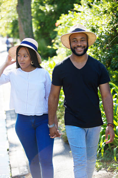 istock Couple Sunny walking together holding hands 1205742029