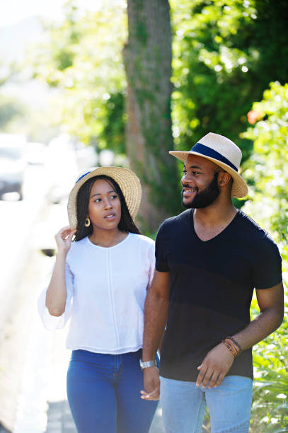 istock Couple Sunny stroll together holding hands with copy space 1205742610