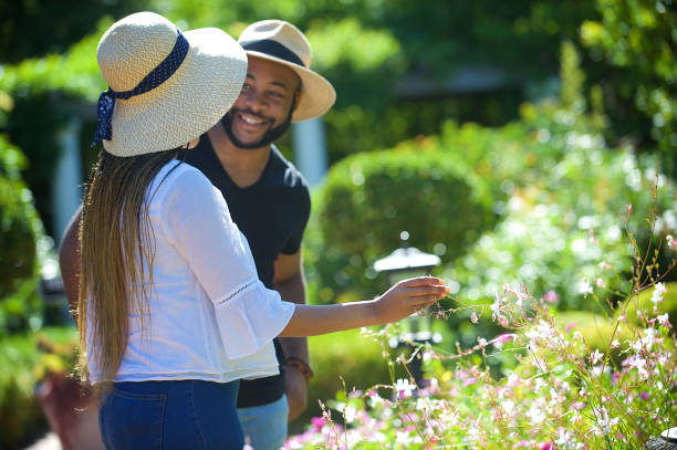istock Smelling the flowers Smiling 1205742675