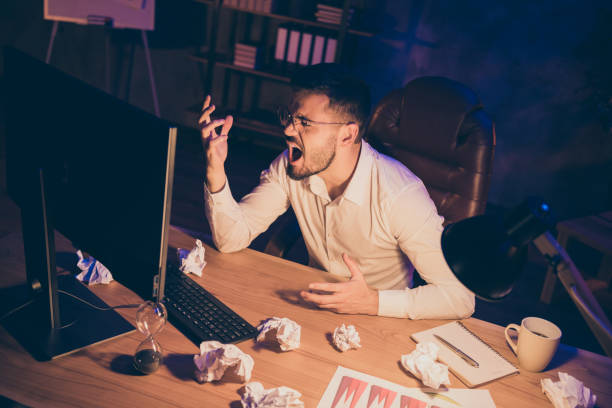 istock Photo of evil angry furious man having found himself fired away from job for assignment undone in time 1205743507