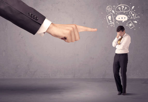 istock Boss hand pointing at confused employee 1205744788