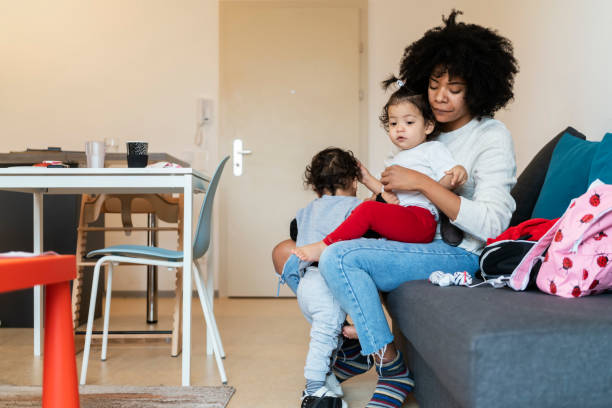 istock Mom and babies at home 1205744884
