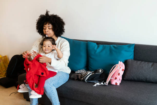 istock Mom and babies at home 1205744890