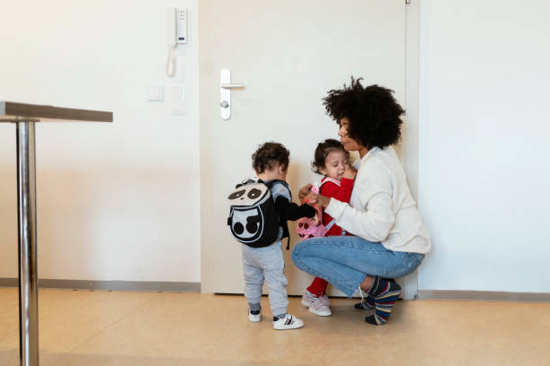 istock Mom and babies at home 1205744972