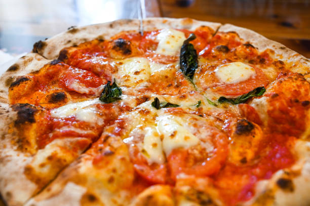istock Closeup margarita pizza in restaurant. 1205746762