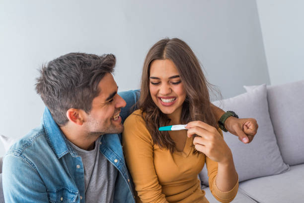istock Affectionate couple finding out results of a pregnancy test 1205750595