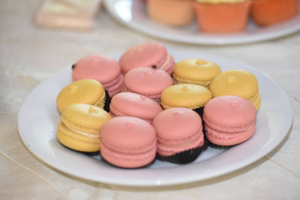 istock Pink and yellow Muffins on the Plate 1205752358