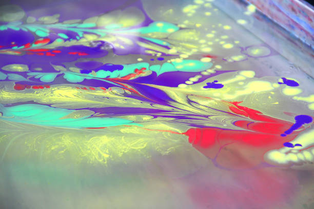 istock Floating oil color on water texture abstract colorful background 1205754470