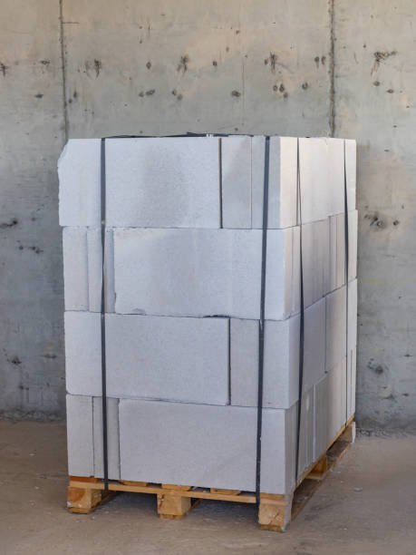 istock Packing aerated concrete blocks for partitions in a building under construction on a pallet 1205755147