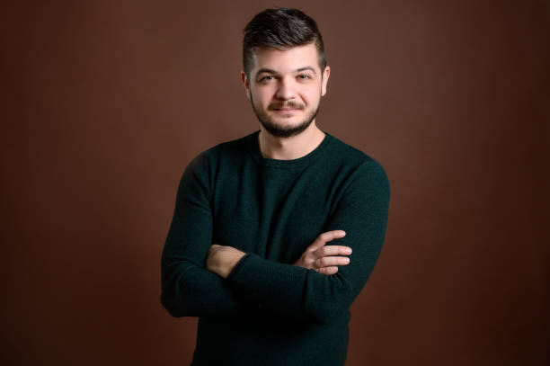 istock Man with brown hair showing confidence 1205756230