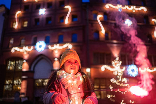 istock She is amazed with pyrotechnical lights effects and colors 1205756407