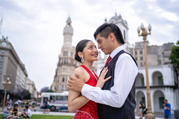 istock Lovely tango partners dancing on a streets of Buenos Aires 1205758414