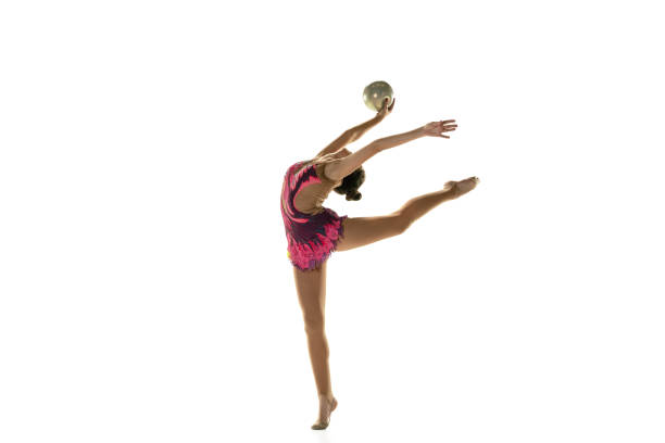 istock Young flexible female gymnast isolated on white studio background 1205758454