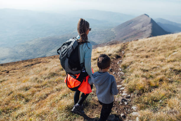 istock Mother and son spending beautiful day while hiking 1205758779