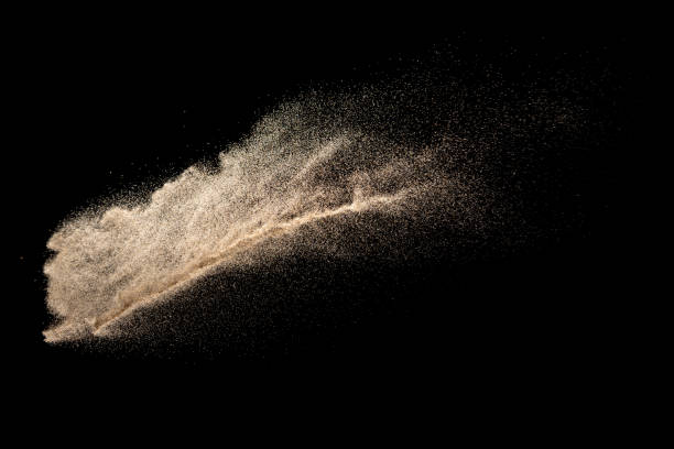 istock Brown colored sand splash.Dry river sand explosion isolated on black background. Abstract sand cloud. 1205761035