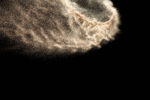 istock Brown colored sand splash.Dry river sand explosion isolated on black background. Abstract sand cloud. 1205761036