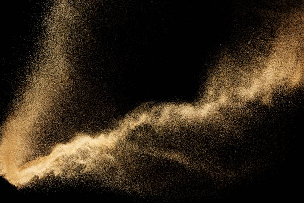 istock Brown colored sand splash.Dry river sand explosion isolated on black background. Abstract sand cloud. 1205761044