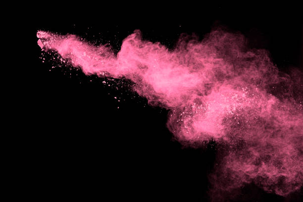 istock Pink powder explosion on black background.Pink dust splash cloud on dark background. 1205761149