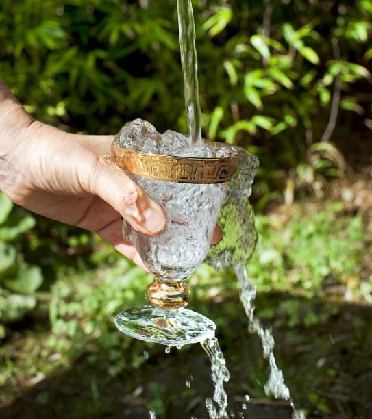 istock Glass goblet under a jet of water 1205761780