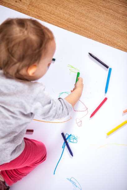 istock Little baby girl drawing 1205762193