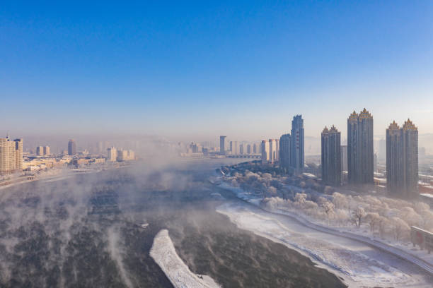 Winter city along the river stock photo