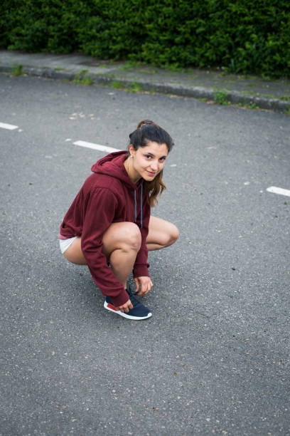 istock sporty woman getting ready for running workout 1205764444