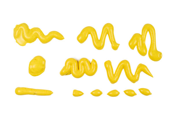 istock Yellow cheese sauce splashes isolated on white background. 1205764449