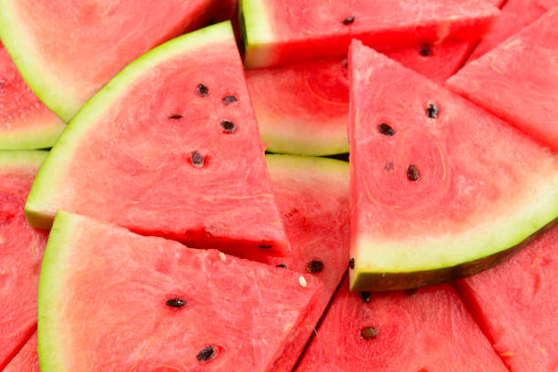 istock Juicy watermelon slices background. Top view. 1205764562