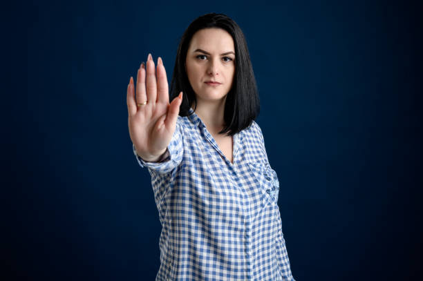 istock Young woman showing stop 1205765254