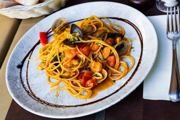 istock Pasta with seafood and vegetables 1205767054