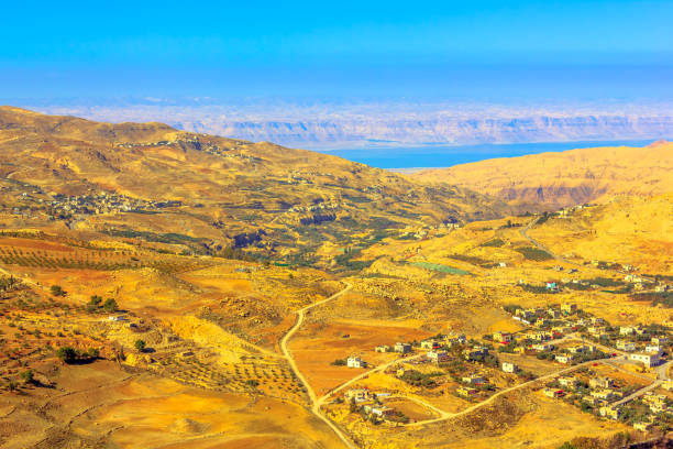 Mount Nebo Landscape View from top of Mount Nebo the place where Moses was granted a view of the Promised Land, to Jordanian desert valley and Dead Sea in the distance. mount nebo jordan stock pictures, royalty-free photos & images