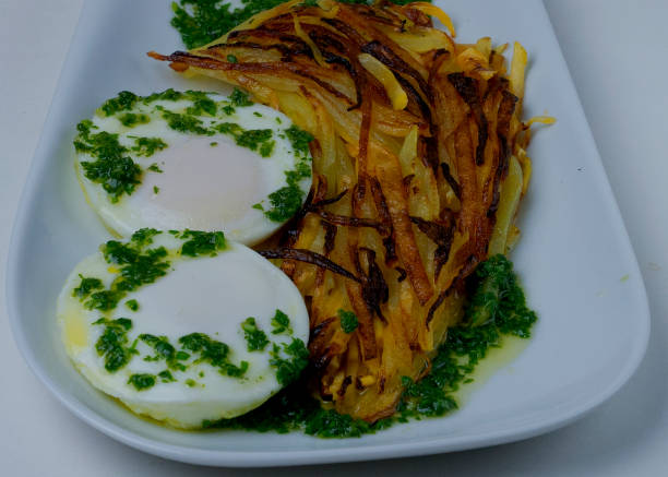 istock Rutabaga and potato hash browns with poached eggs and arugula coulis 1205768618