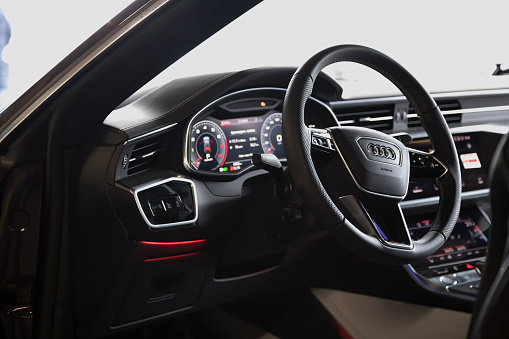 Moscow. Russia - January 16, 2020: Interior of a premium sedan Audi A7 Sportback Ultra Nova GT 1 of 111. Black leather seats and dashboard, led screens with touchpads. climate control and shifters