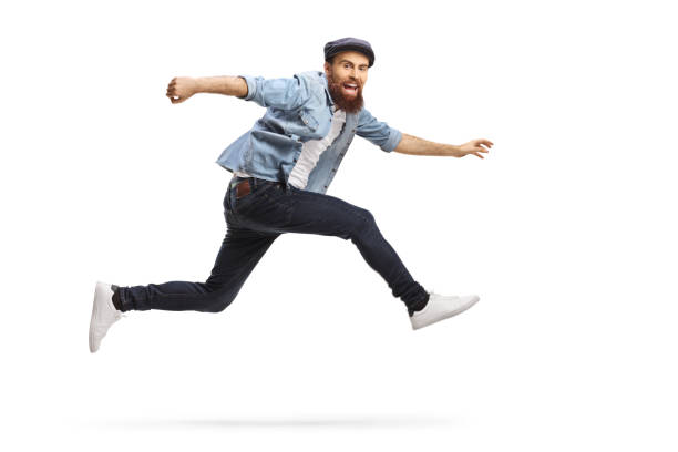 istock Bearded man in casual clothes jumping 1205770900
