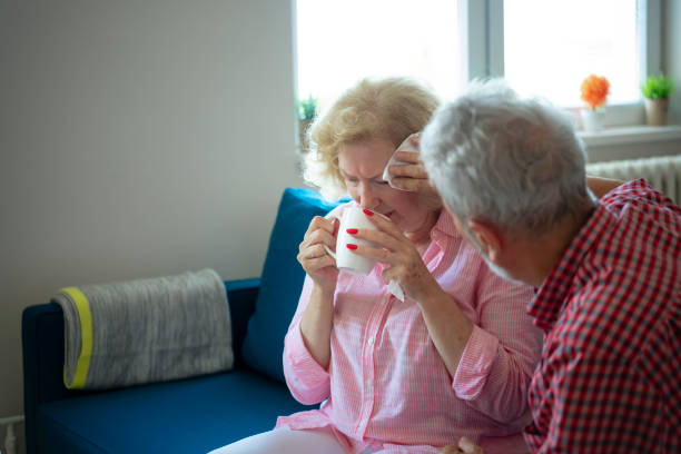 istock Through sickness, health and everything in between. Senior husband helping his ill spouse 1205771030