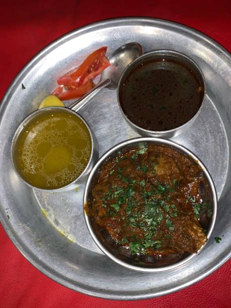 Traditional chicken thali with soup