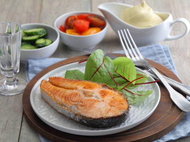istock Roasted salmon steak with chard and vegetables 1205775958