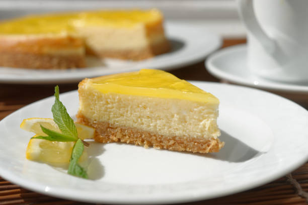 istock Lemon cheesecake served with lemon slices and mint leaf 1205776197