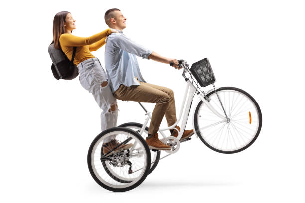 istock Young man riding a female student on a tricycle 1205776866