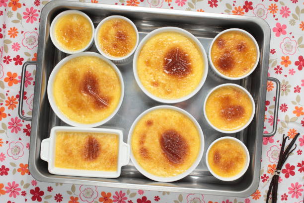 set of creme brulee in baking dishes. top view - dessert ready to eat creme brulee food imagens e fotografias de stock