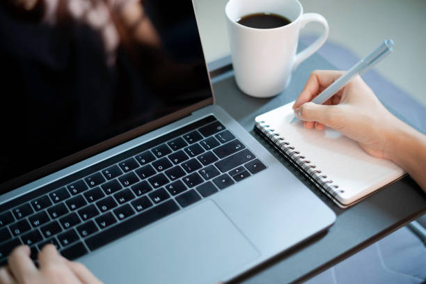 istock Closeup poerson woring on laptop at home office 1205777219
