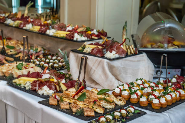 istock Catering buffet table with cold snacks. Delicious appetizers on the table, self serve. 1205777331