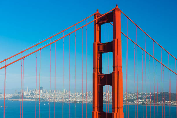 San Francisco City of San Francisco seen through wires of the Golden Gate Bridge. California, USA san francisco county city california urban scene stock pictures, royalty-free photos & images