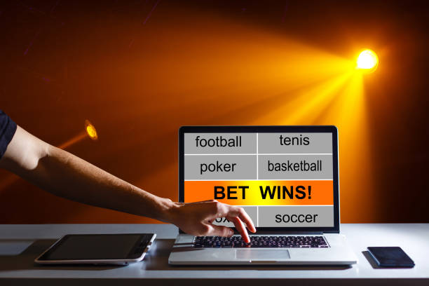 istock Euphoric winner happy man using a laptop in a desk at home 1205778604