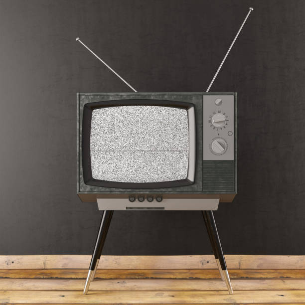 old retro tv gegen schwarze wand - old obsolete house black and white stock-fotos und bilder