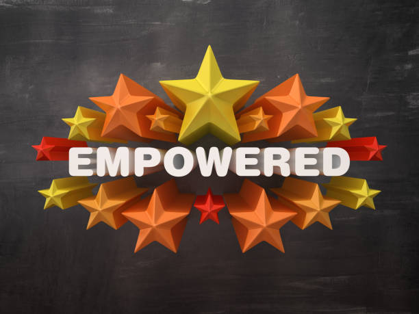 istock Colorful Stars with EMPOWERED Word on Chalkboard Background - 3D Rendering 1205780428