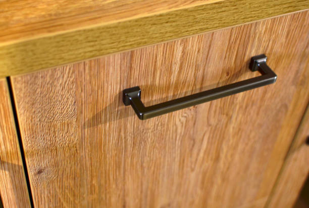 istock Black metal designer handle on the cabinet door 1205782046