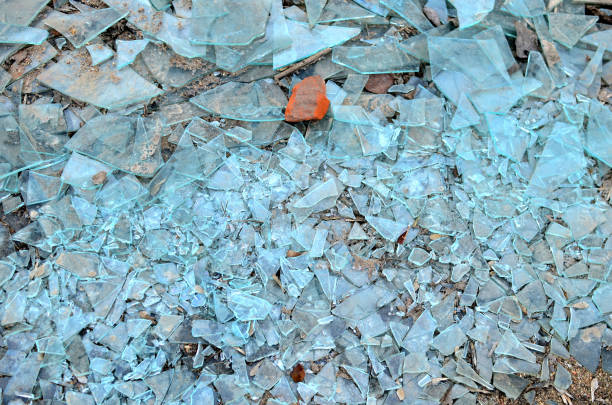 istock Many broken glass pieces on the ground, can be used as a background, texture 1205782274