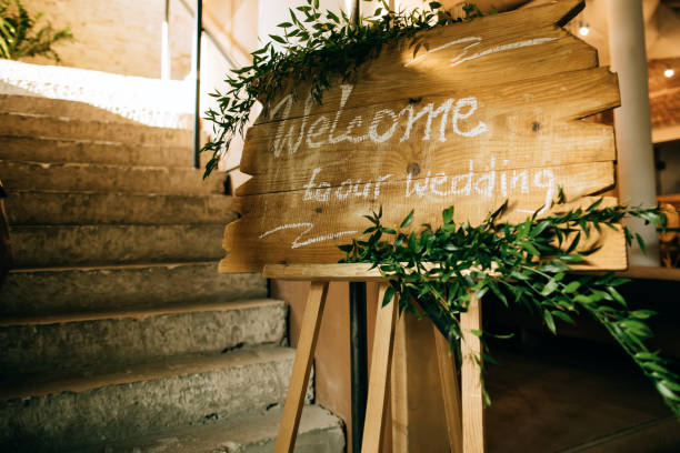 istock Welcome -  Invitation for guests on a wooden board at the restaurant. 1205785318