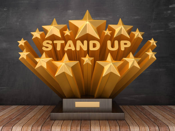 istock Gold Stars with STAND UP Word  on Trophy - Chalkboard Background - 3D Rendering 1205786935